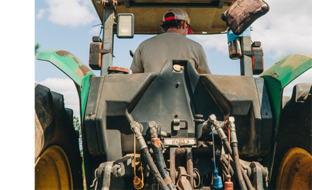 Connector Supplier Article Link - Img of man in tractor
